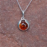 (AP76) Silver And Orange Amber Round Pendant